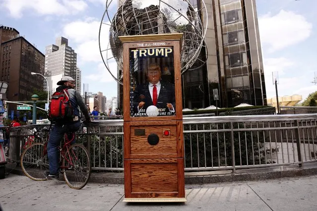 A Donald Trump themed fortune telling machine stands on the street in Columbus Circle in New York, U.S., October 12, 2016. (Photo by Lucas Jackson/Reuters)