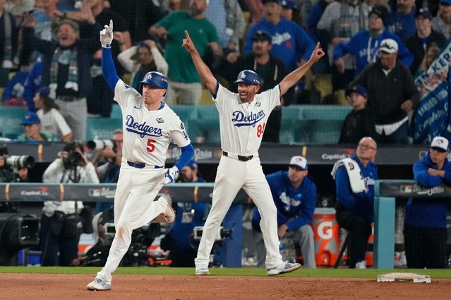 Los Angeles Dodgers first baseman Freddie Freeman, left, celebrates after hitting a home run to win Game 3 of the World Series on Monday, October 27, 2025. The home run came in the 18th inning and was the second-longest game in World Series history. (Photo by Mark J. Terrill/AP Photo)