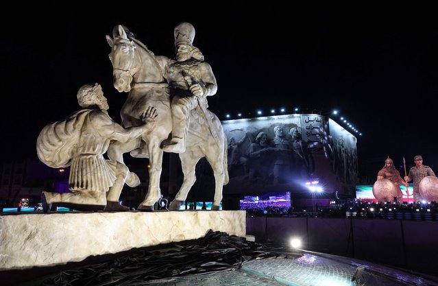 A photograph shows a statue depicting Sasanian king Shapur I capturing Roman emperor Valerian during its unveiling at Enghelab (Revolution) Square in the capital Tehran on November 7, 2025. The event was the latest in a series of unveiling national symbols following Iran's recent 12-day war with Israel in June. The statue was modelled on an original stone engraving in southern Iran, symbolising Iranian triumph over foreign foes. (Photo by AFP Photo/Stringer)