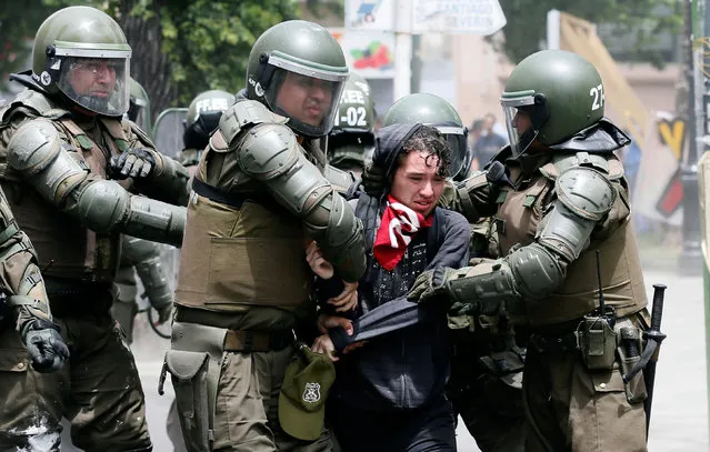 A demonstrator is detained by riot police during a strike against the national pension system in Valparaiso, Chile November 4, 2016. (Photo by Rodrigo Garrido/Reuters)