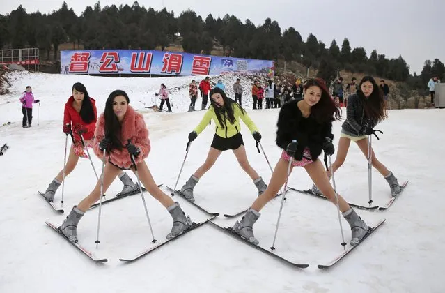 Women wearing no pants pose for photographs during a promotional event at a ski resort to echo the “No Pants Subway Ride” event, in Xuzhou, Jiangsu province January 13, 2015. (Photo by Reuters/Stringer)