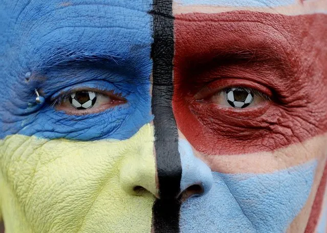 A Burnley who paints his face in support of Ukraine amid Russia's invasion, is seen outside the stadium before Burnley v Manchester City Premier League match in Burnley, Britain on April 2, 2022. (Photo by Lee Smith/Action Images via Reuters)
