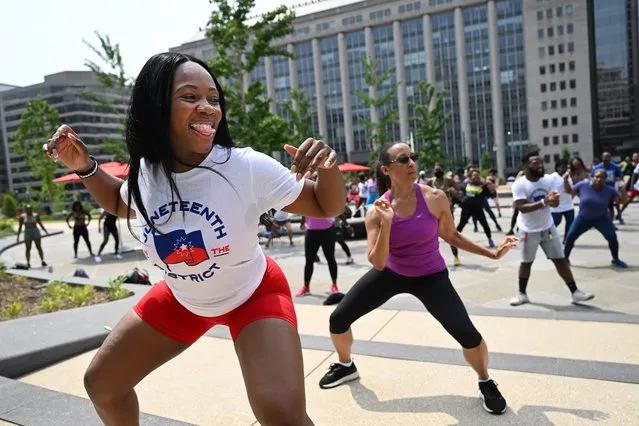 Markisa “Kis” Blount, left, helps leads a dance based exercise class in Franklin Square as part of the FITDC’s Juneteenth Health and Wellness Fair on Monday June 19, 2023 in Washington, DC. (Photo by Matt McClain/The Washington Post)