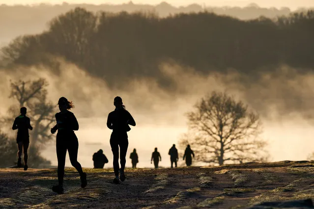 Early morning runners and walkers in Richmond Park in London, United Kingdom on February 26, 2021. (Photo by John Walton/PA Images via Getty Images)