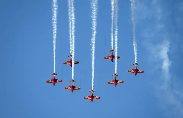 Jets of the Royal Moroccan Armed Forces perform above the city of M'diq marking the 24th anniversary of Morocco's King Mohammed VI accession to the throne, on July 30, 2023. (Photo by Fadel Senna/AFP Photo)