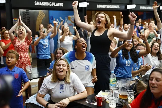 England fans celebrate following a screening of the FIFA Women's World Cup 2023 semi-final at BOXPARK Wembley, London on Wednesday, August 16, 2023. England will play Spain in the final of the Women's World Cup on Sunday after beating co-hosts Australia 3-1 in the semi-final in Sydney. (Photo by Peter Cziborra/Reuters)