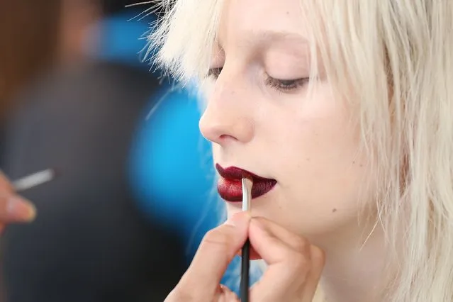 A model gets makeup applied backstage at Houghton runway show during MADE Fashion Week Fall 2015 at Milk Studios on February 16, 2015 in New York City. (Photo by Mireya Acierto/Getty Images)