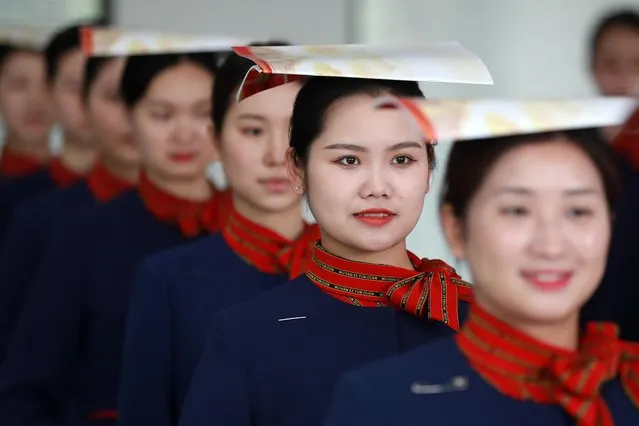 High-speed train attendants take part in a training session for the coming May Day holiday travel rush on April 27, 2021 in Wuhan, Hubei Province of China. (Photo by Zhao Jun/VCG via Getty Images)