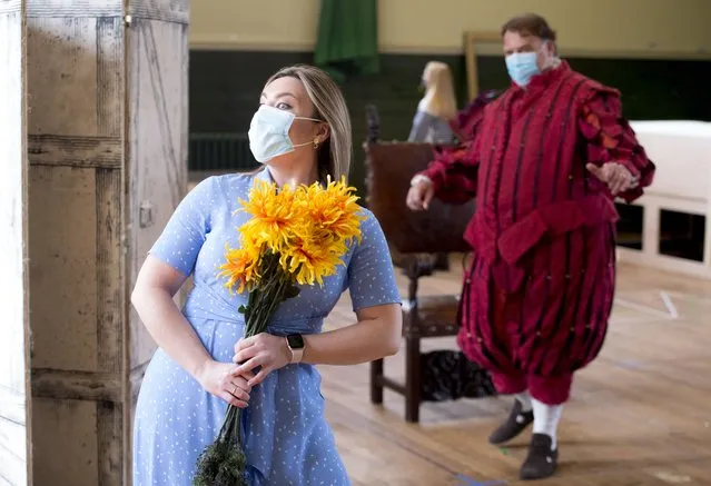 Natalya Romaniw and Bryn Terfel are masked and socially distanced during a rehearsal of Falstaff for the Grange Park Opera on Monday, May 10, 2021. The rehearsals have been taking part at Alford House, in London, before the opera is seen from the 10th June-18 July. (Photo by Ian West/PA Images via Getty Images)