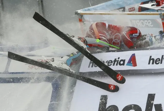 Henrik Kristoffersen of Norway crashes into the barrier after winning the men's Alpine Skiing World Cup slalom in Wengen, Switzerland January 17, 2016. (Photo by Ruben Sprich/Reuters)