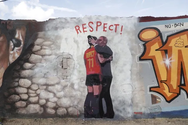 A graffiti by urban artist TVBoy depicts President of the Royal Spanish Soccer Federation (RFEF) Luis Rubiales kissing Spanish player Jenni Hermoso, in Barcelona, Spain, 01 September 2023. Suspended RFEF President Luis Rubiales announced on 25 August that he would not resign over the kiss on the lips he gave to Spanish player Jenni Hermoso during celebrations of the FIFA Women's World Cup final. (Photo by Quique Garcia/EPA)