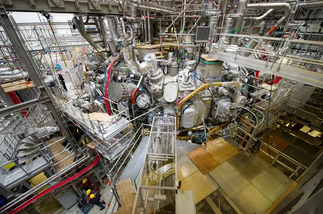 This December 10, 2015 file photo shows the nuclear fusion research center at the Max Planck Institute for Plasma Physics where the first plasma has been produced at the “Wendelstein 7-X” in Greifswald, Germany. Scientists are poised to flip the switch on an experiment that could take them a step closer to the goal of generating clean and cheap nuclear power. Researchers at the institute plan to inject hydrogen into a doughnut-shaped device to produce a super-hot gas known as plasma.  (Photo by Stefan Sauer/DPA via AP Photo)