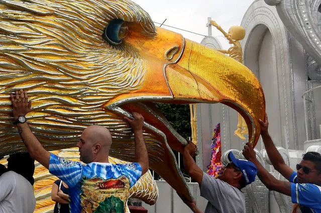 Men work to complete carnival floats in São Paulo, Brazil on February 4, 2016. (Photo by Rahel Patrasso/Xinhua Press/Corbis)