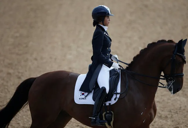 In this photo taken on September 20, 2014, South Korea's Chung Yoo-ra, the daughter of Choi Soon-sil, the confidante of disgraced President Park Geun-hye, competes during the equestrian dressage team competition for the 17th Asian Games in Incheon, South Korea. South Korean prosecutors said Monday, Jan. 2, 2017, Chung has been arrested in Denmark and authorities are working to get her returned home in connection with a huge corruption scandal. (Photo by Kim Hong-Ji/Reuters)