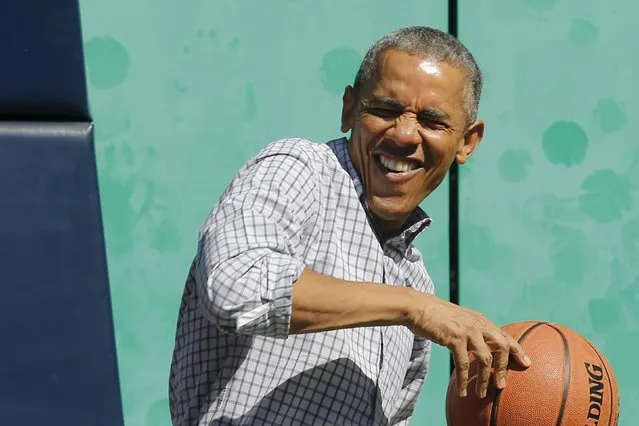 U.S. President Barack Obama reacts to getting hit on the head by a rebound while playing basketball, an exercise activity during the annual Easter Egg Roll at the White House in Washington April 6, 2015. (Photo by Jonathan Ernst/Reuters)