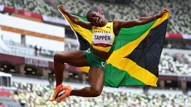 Jamaica's Megan Tapper reacts after the women's 100m hurdles final during the Tokyo 2020 Olympic Games at the Olympic Stadium in Tokyo on August 2, 2021. (Photo by Dylan Martinez/Reuters)
