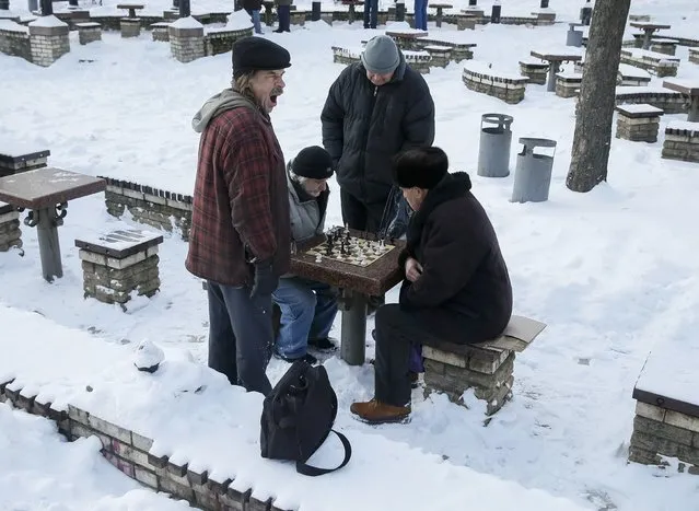 Men play chess on a winter day in a park in central Kiev, Ukraine, January 12, 2017. (Photo by Gleb Garanich/Reuters)