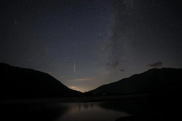 A view of meteor streaks in the night sky during annual Perseid meteor shower at Shebenik National Park, in Fushe Stude, Albania on August 13, 2023. (Photo by Florion Goga/Reuters)