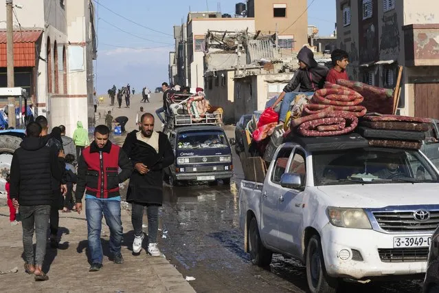 Palestinians flee the Israeli ground offensive in the central Gaza Strip, heading south through Deir al BalahFriday, January 5, 2024. (Photo by Adel Hana/AP Photo)