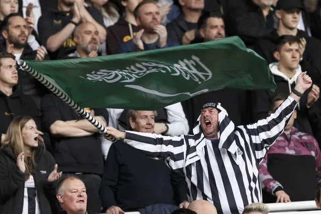 A Newcastle United fan waves a Saudi Arabian flag during the Premier League match between Newcastle United and Tottenham Hotspur at St. James Park on October 17, 2021 in Newcastle upon Tyne, England. (Photo by Daniel Chesterton/Offside/Offside via Getty Images)