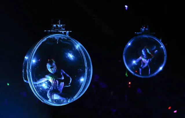 Acrobats perform in transparent balls hung from the rafters during the opening night show of the Ringling Bros. and Barnum & Bailey Circus, Thursday, February 23, 2017, in New York. (Photo by Julie Jacobson/AP Photo)