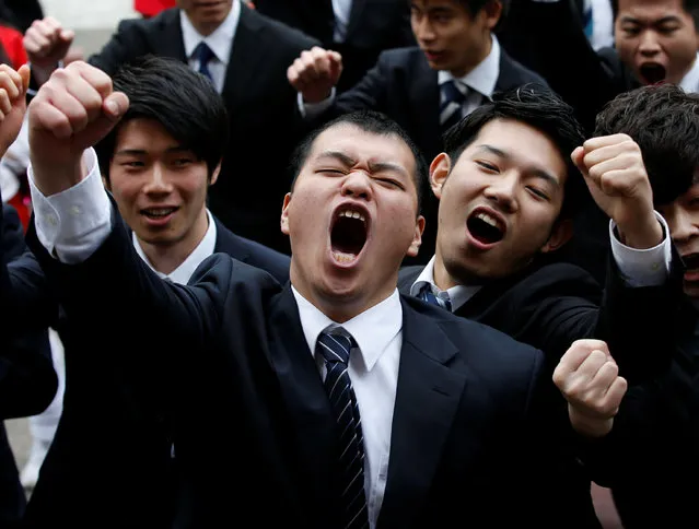 College students shout slogans during a pep rally organised to boost their morale ahead of their job hunting in Tokyo, Japan March 1, 2017. (Photo by Kim Kyung-Hoon/Reuters)