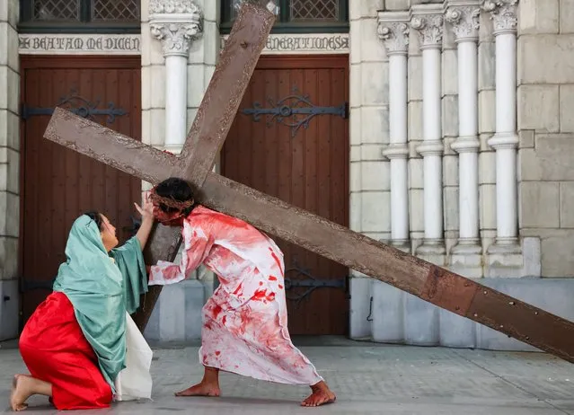 Youth perform a re-enactment of the crucifixion of Jesus Christ during Good Friday at Jakarta Cathedral in Jakarta, Indonesia, on March 29, 2024. (Photo by Ajeng Dinar Ulfiana/Reuters)