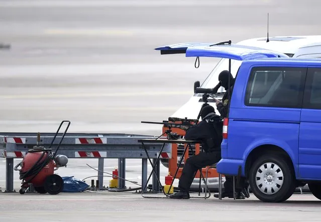 German police officers prepare their equipment ahead of U.S. President Barack Obama visit to Hanover, Germany April 24, 2016. (Photo by Nigel Treblin/Reuters)