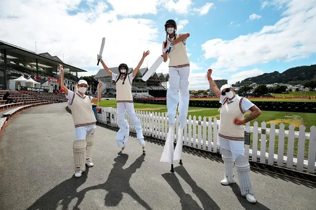 Performers pose during the 2022 ICC Women's Cricket World Cup match between Australia and West Indies at Basin Reserve on March 15, 2022 in Wellington, New Zealand. (Photo by Hagen Hopkins-ICC/ICC via Getty Images)