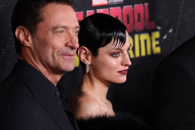 Australian actor Hugh Jackman (L) and British actress Emma Corrin attend the “Deadpool & Wolverine” premiere at David H. Koch Theater in New York City on July 22, 2024. (Photo by Charly Triballeau/AFP Photo)