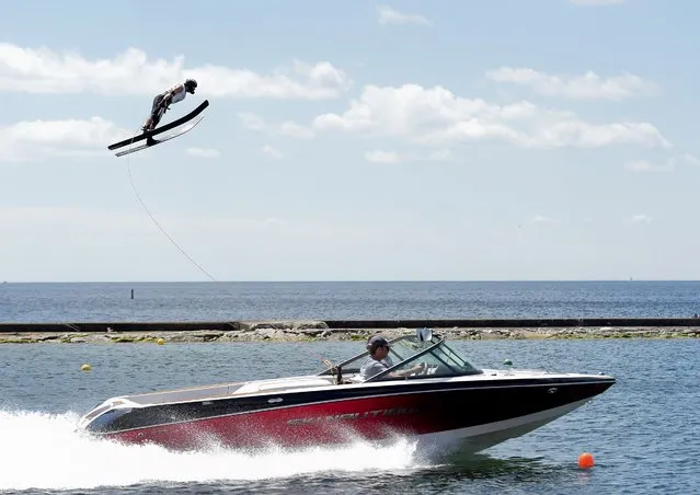 Canada's Ryan Dodd sails through the air in the men's watersky jump preliminary round during the Pan Am Games in Toronto, Tuesday, July 21, 2015. Dodd finished in first place. (Photo by Nathan Denette/The Canadian Press via AP Photo)