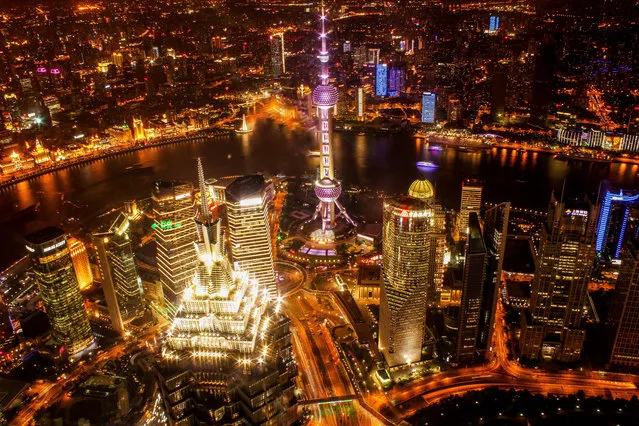 “Shanghai Nightline”. This is the shot I came to Shanghai for. I waited till night to buy my ticket to the top of the World Financial Center to capture the intensity and sprawling size of China's metropolis. Photo location: Shanghai, China. (Photo and caption by Collin Hadley/National Geographic Photo Contest)