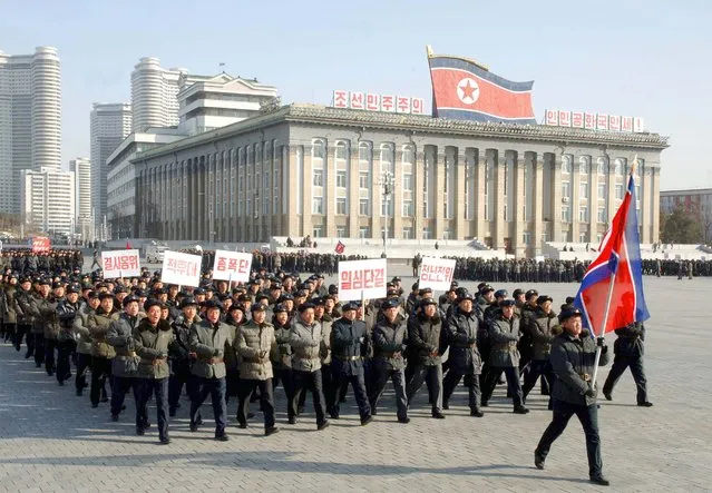North Korean youths march at Kim Il Sung Square to celebrate the anniversary of the February 8 founding of the regular revolutionary armed forces of Korea, in this undated photo released by North Korea's Korean Central News Agency (KCNA) in Pyongyang on February 8, 2015. (Photo by Reuters/KCNA)