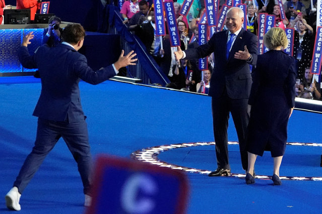 U.S. Democratic vice presidential nominee Minnesota Governor Tim Walz's son Gus Walz runs to him onstage during Day 3 of the Democratic National Convention (DNC) at the United Center, in Chicago on August 22, 2024. (Photo by Elizabeth Frantz/Reuters)