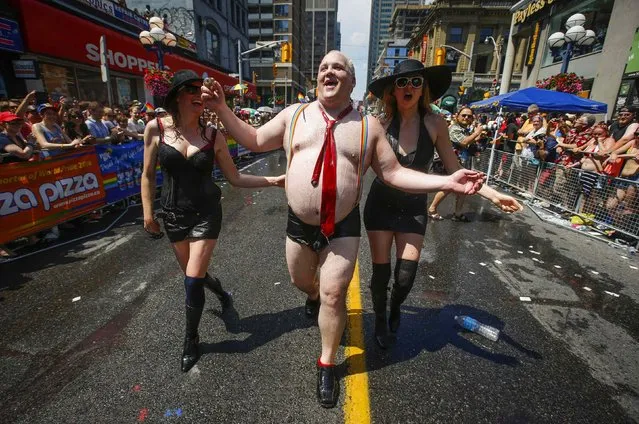 A man dressed to mock Toronto Mayor Rob Ford takes part in the “WorldPride” gay pride Parade in Toronto June 29, 2014. Toronto is hosting WorldPride, a week-long event that celebrates the lesbian, gay, bisexual and transgender (LGBT) community. (Photo by Mark Blinch/Reuters)
