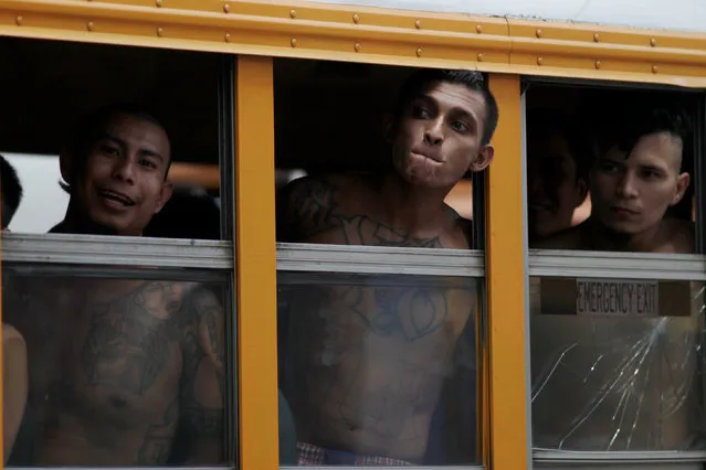 Members of the Barrio 18 Gang wait on a bus as 1282 inmates are transferred from the cojutepeque jail in Cojutepeque, El Salvador June 16, 2016. (Photo by Jose Cabezas/Reuters)