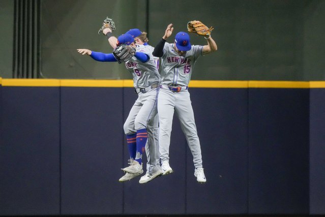 New York Mets' Brandon Nimmo, Harrison Bader, and Tyrone Taylor celebrate after Game 2 of a National League wild card baseball game against the Milwaukee Brewers Tuesday, October 1, 2024, in Milwaukee. The Mets won 8-4. (Photo by Morry Gash/AP Photo)