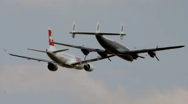A new Bombardier CS100 passenger jet (L) of Swiss airlines is accompanied by a vintage Lockheed Super Constellation aircraft upon its arrival at Zurich airport near the town of Kloten, Switzerland July1, 2016. (Photo by Arnd Wiegmann/Reuters)