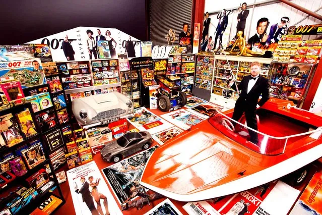 A recent undated handout picture released by the Guinness World Records on September 9, 2014, shows 47-year-old Nick Bennett from Leigh in Lancashire, UK, who has secured his place in the Guinness World Records 2015 book for owning the Largest Collection James Bond Memorabilia, a staggering 12, 463 items at last count. (Photo by Richard Bradbury/AFP Photo/Guinness World Records)