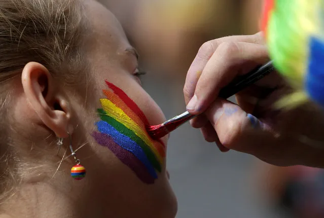 Participants prepare for the Prague Pride Parade where thousands marched through the city centre in support of gay rights, in Czech Republic, August 13, 2016. (Photo by David W. Cerny/Reuters)