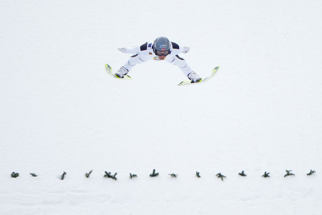 Norway's Jarl Magnus Riiber soars through the air during the mixed team normal Hill HS102/4x5km Nordic Combined event at the FIS Nordic World Ski Championships in Trondheim, Norway on February 27, 2025. (Photo by Lise Aserud/NTB via AFP Photo)
