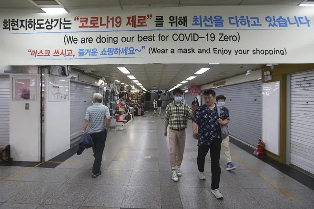 People walk through an underground shopping mall in Seoul, South Korea, Thursday, June 11, 2020. (Photo by Ahn Young-joon/AP Photo)