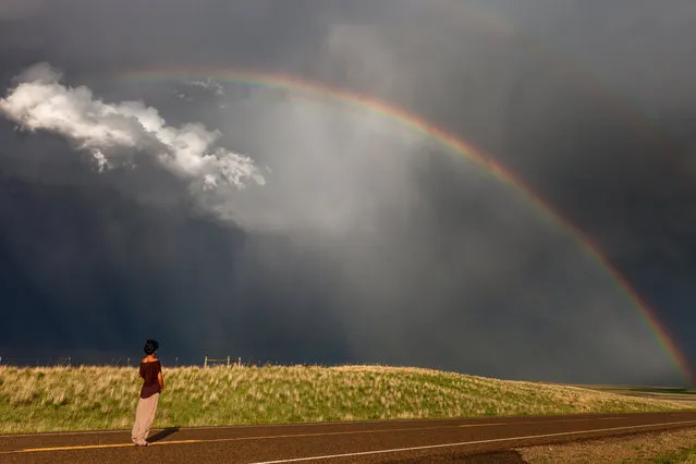 Double Rainbow – Daow looking at the storm. (Photo by Nicolaus Wegner/Caters News)