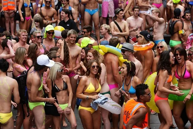 Sydneysiders take part in the “AIME Strut the Streets” in an attempt to break the Guiness record for the world's largest swimwear parade on December 7, 2012 in Sydney, Australia. The event was organised to raise funds and awareness for the not for profit charity organisation, the Australian Indigenous Mentoring Experience.  (Photo by Lisa Maree Williams)