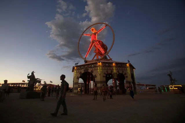 The Man is illuminated as approximately 70,000 people from all over the world gather for the 30th annual Burning Man arts and music festival in the Black Rock Desert of Nevada, U.S. August 31, 2016. (Photo by Jim Urquhart/Reuters)