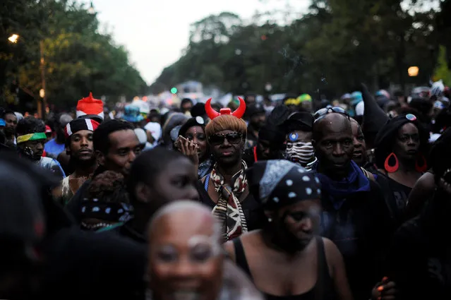 A woman wears devil's horns while marching in the overnight-into-dawn celebration called J'Ouvert, ahead of the annual West Indian-American Carnival Day Parade in Brooklyn, NY, U.S. September 5, 2016. (Photo by Mark Kauzlarich/Reuters)