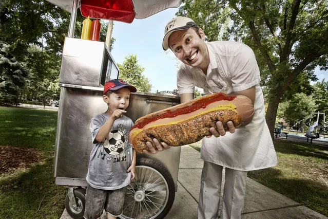 Dan Abbate – Largest Hot Dog Commercially Available: The big hot dog 16 inches long, four inches thick and made from beef, veal and pork in Chicago. Guinness World Records 2011. Location: Chicago, USA. (Photo by Kevin Scott Ramos/Guinness World Records)