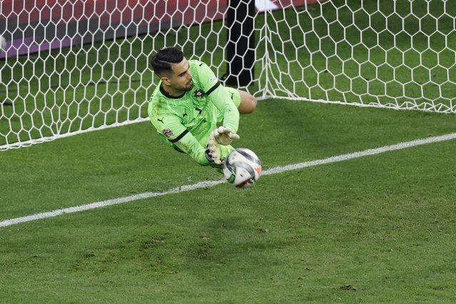 Portugal's goalkeeper #01 Diogo Costa saves the penalty by Spain's forward #07 Alvaro Morata (unseen) during the UEFA Nations League final football match between Portugal and Spain in Munich, southern Germany on June 8, 2025. (Photo by Alexandra Beier/AFP Photo)