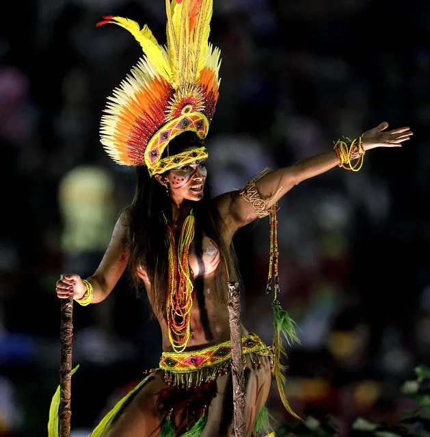 A performer from the Imperatriz Leopoldinense samba school parades during carnival celebrations at the Sambadrome in Rio de Janeiro, Brazil, Tuesday, February 12, 2013. Rio de Janeiro's samba schools vied for the title of the year's best Monday in an over-the-top, all-night-long Carnival parade at the city's iconic Sambadrome (Photo by Hassan Ammar/AP Photo)