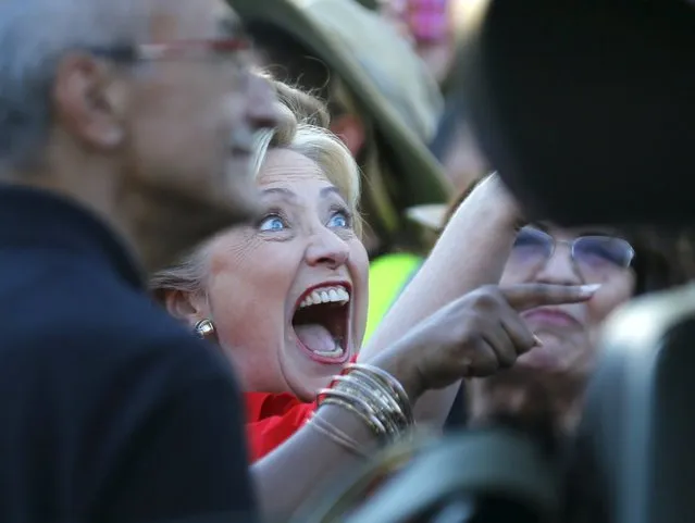 Democratic U.S. presidential candidate and former Secretary of State Hillary Clinton greets members of the culinary workers union local 226  as she arrives to speak at a demonstration outside the Trump Hotel in Las Vegas, Nevada October 12, 2015. The union was protesting wages and contracts saying if Donald Trump wanted to make America great again he should start with the workers here. (Photo by Mike Blake/Reuters)